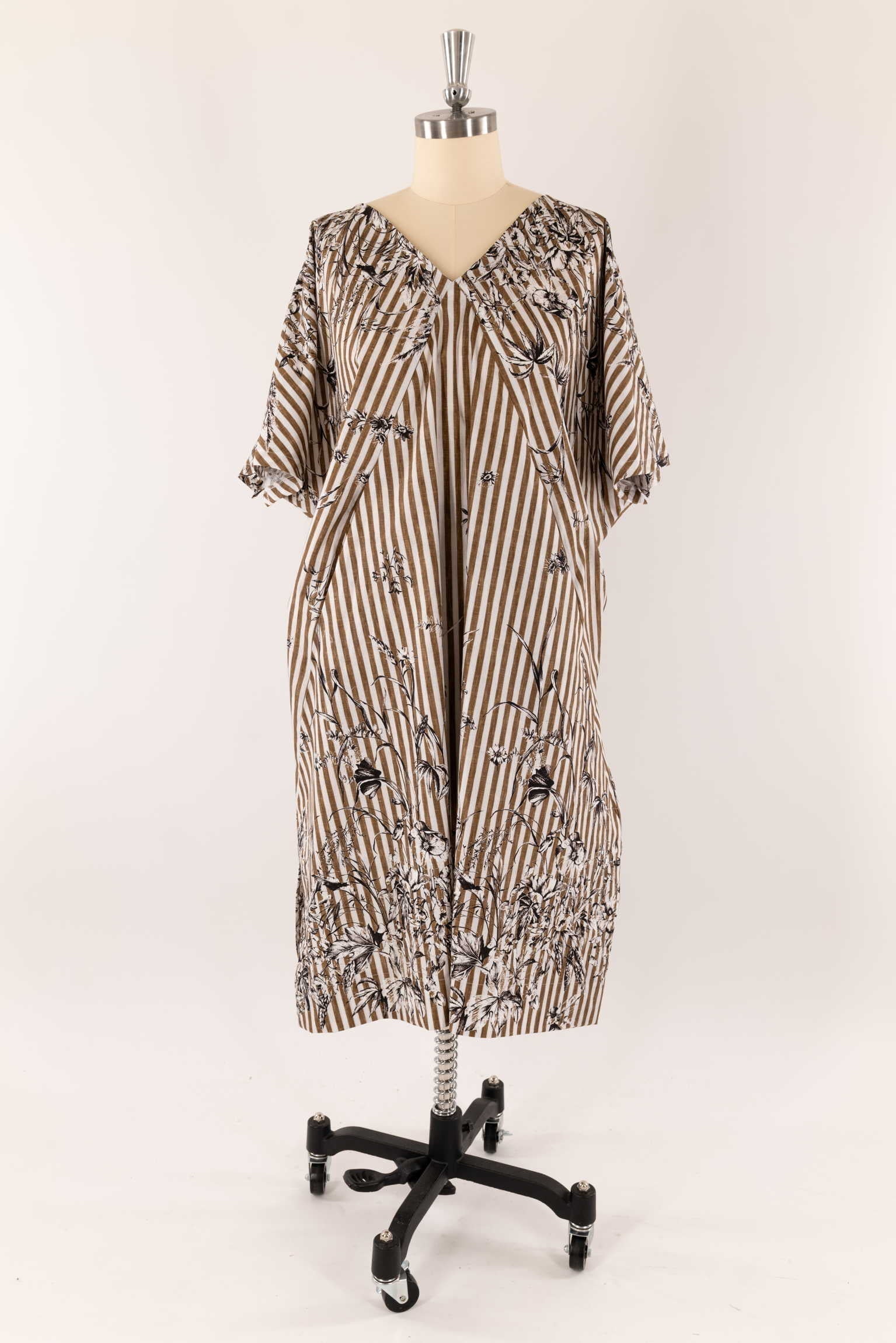 Striped floral dress on mannequin, ideal for sewing apparel with cotton or linen fabric