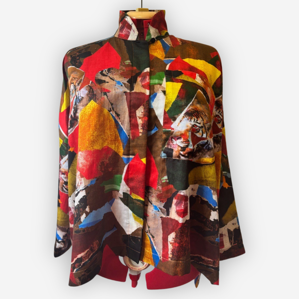Vibrant abstract tiger print fabric shirt, bold geometric colors, designer apparel textile