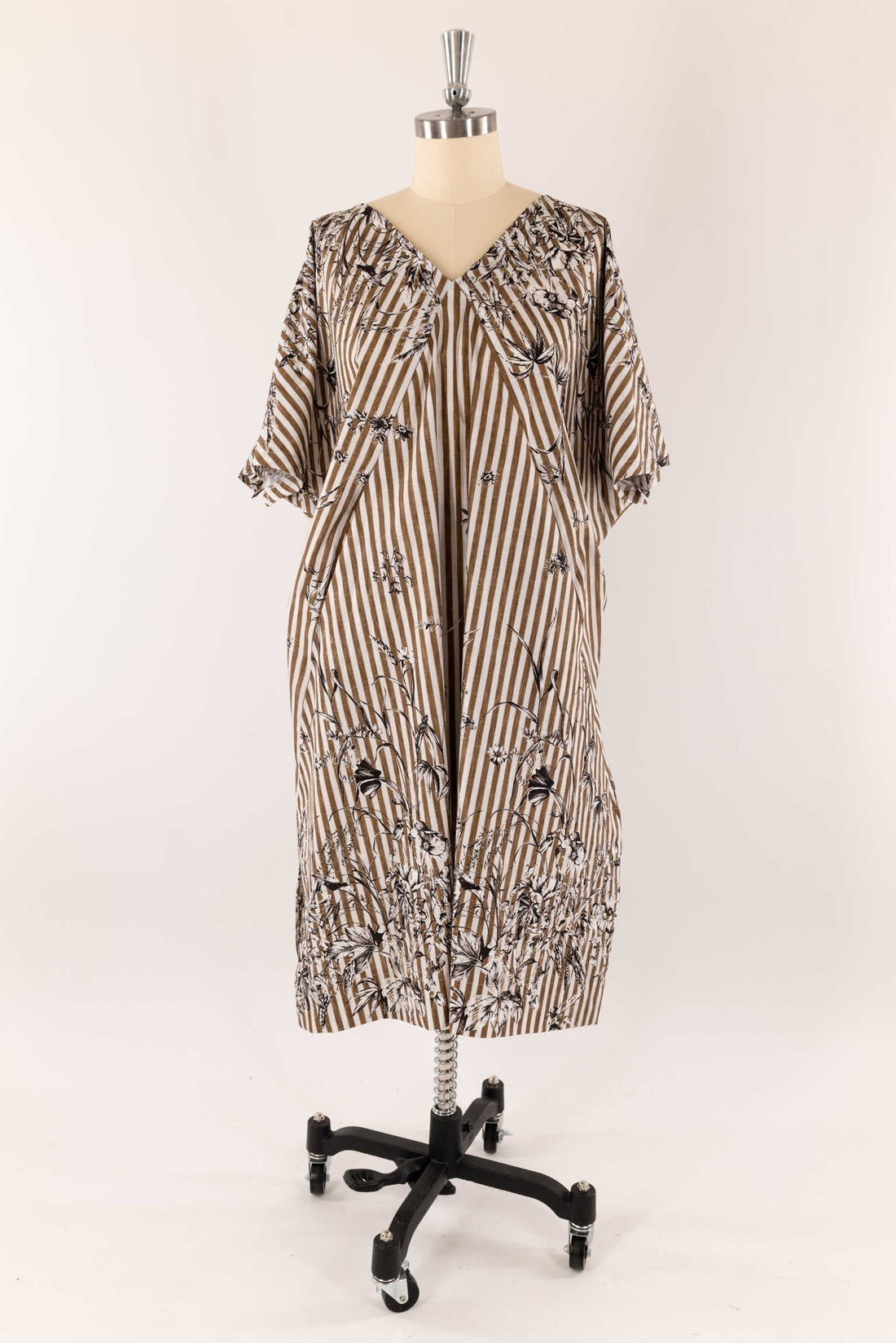 Striped floral dress on mannequin, ideal for sewing apparel with cotton or linen fabric