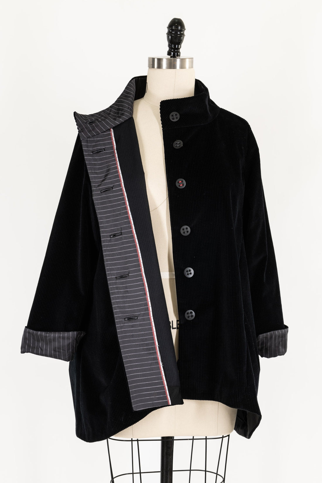 Black corduroy jacket with striped lining, button front, displayed on mannequin for sewing projects