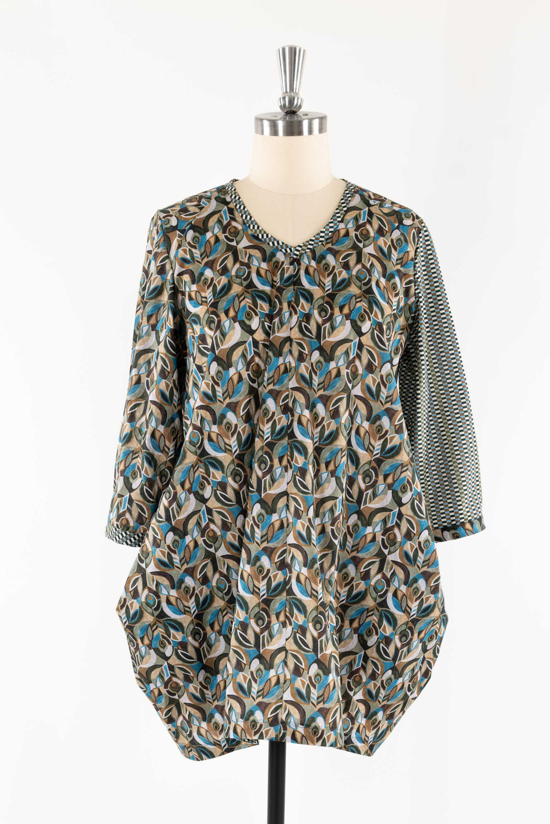 Abstract leaf print tunic with checkered sleeves, ideal for sewing apparel and creative fashion projects.