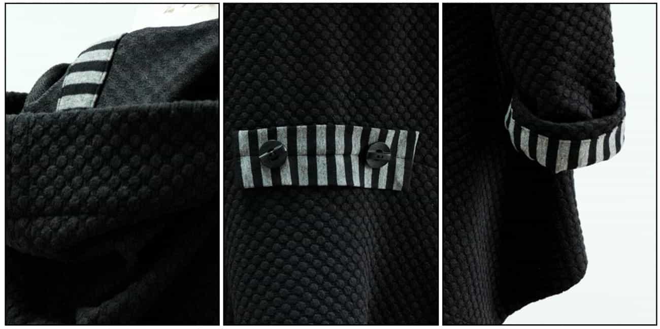 Black textured fabric with striped contrast cuffs and button details, ideal for apparel sewing projects.